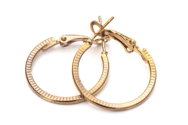 Old gold colour hoop earrings, pair, on white background.